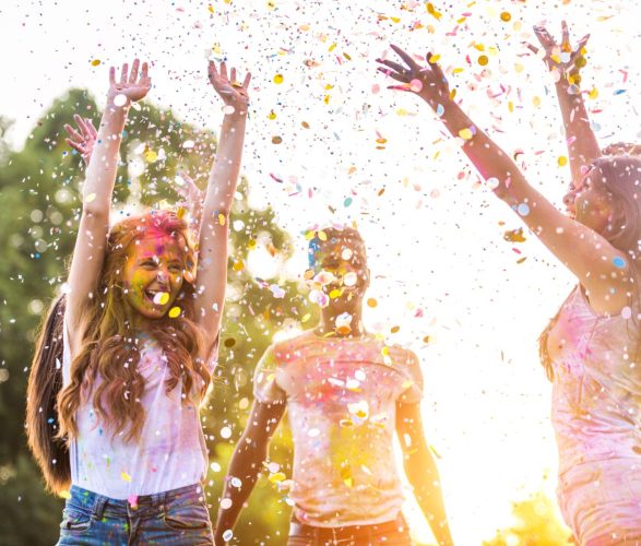 Friends playing with holi powder